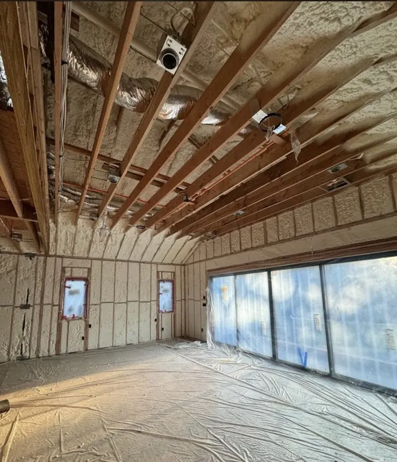 Interior walls and ceiling insulated with spray foam during new construction in Warren